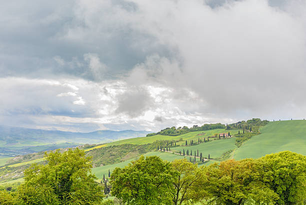 Landscape view of a rural valley with rain clouds