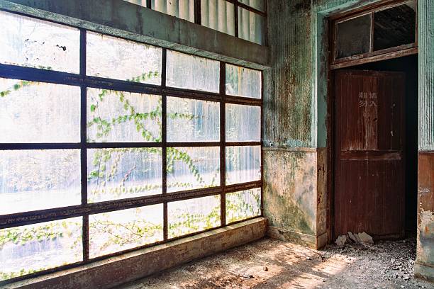 an old room with destroyed windows in an abandoned place at beelitz Heilstätten