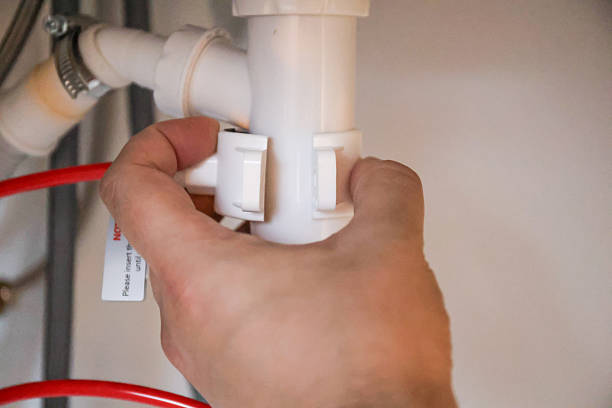 istock Connecting a drainpipe of a reverse osmosis system to sink siphon 2258448856