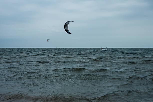 Kiteboarding kite surfers rides the waves on the Caribbean Sea.