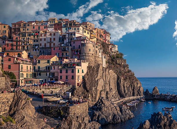 Manarola, Italy, Liguria, Cinque Terre. Beautiful view of the fisherman village on the rock at the sunset.
