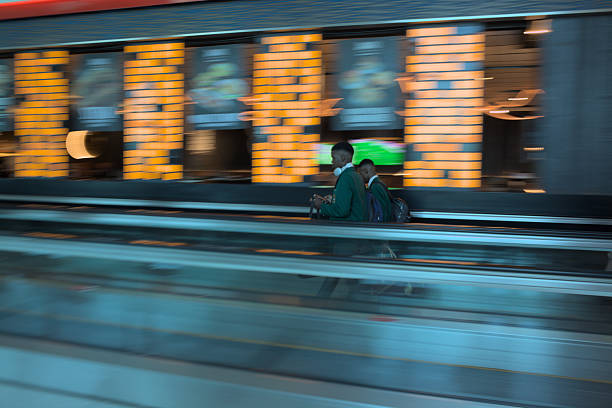 Passengers on Dubai Airport's travelators, AI Garhoud, shops in the passenger transit area and departure gates at Terminal 3 in April 2025 UAE