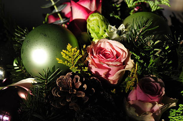 Green Christmas bauble in a bouquet of flowers