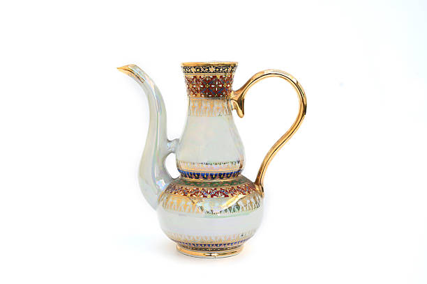 Thai ceramic ware handcrafted tea pot isolated on a white background.Benjalongtea pot.