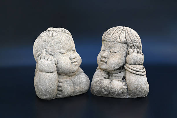 Old sculpture dolls on a dark background