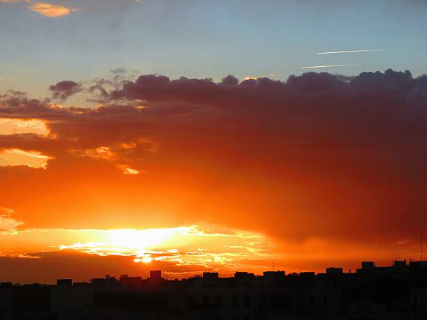 City sunset with beautiful colorful clouds.