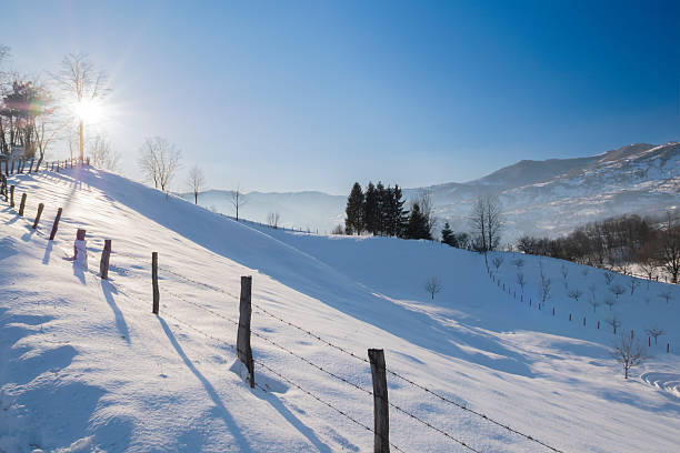 Wooden fence on a meadow in the mountains. Background