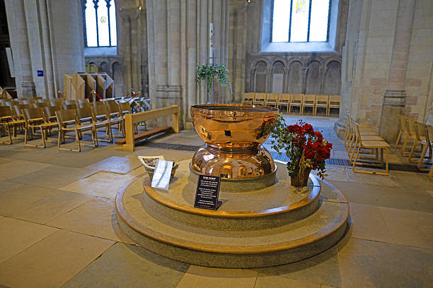 A wooden baptismal font inside a church