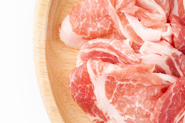 Close-up of thinly sliced raw pork shoulder loin