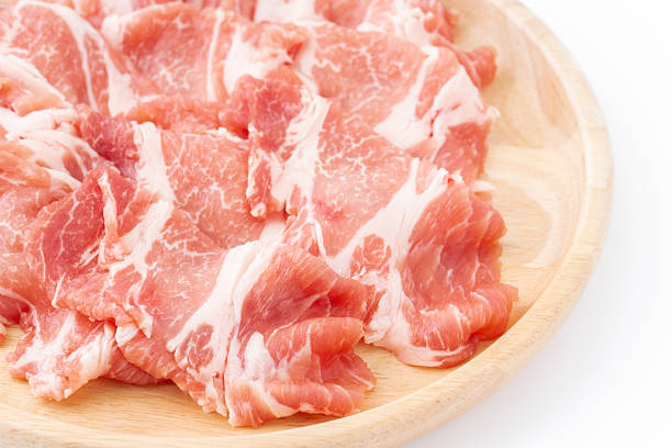 Close-up of thinly sliced raw pork shoulder loin