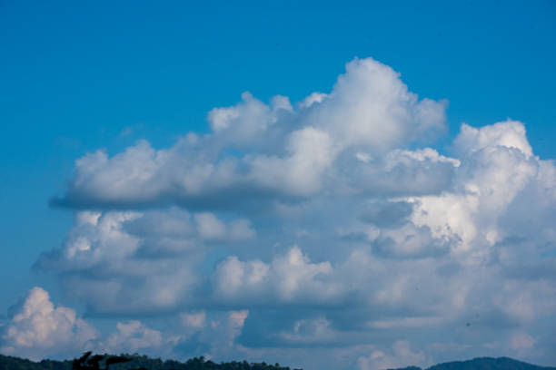 Blue sky fluffy white clouds on summer season bright clear skyline with beautiful cloudscape. Panorama blue sky clouds pattern on daylight with copy space. Cumulus cloudscape air climate sunny day