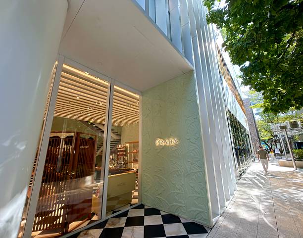 Miami, Florida, United States of America - January 11, 2026: Prada store storefront in the vibrant Miami Design District featuring modern architecture, luxury fashion, and a pedestrian walking on the sunny sidewalk