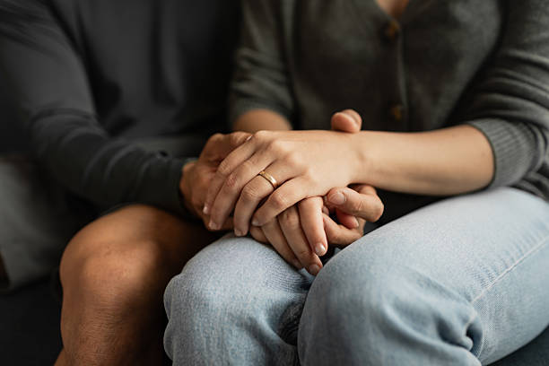 istock Married couple Sharing an Intimate Moment at Home Holding Hands. 2258527676