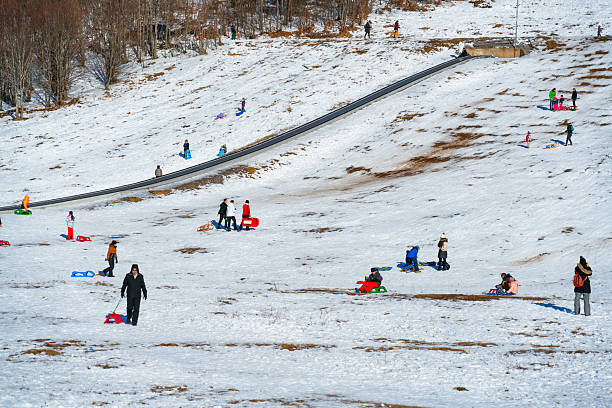 Winter Sled in the Snow by Unrecognizable Person's Legs in Colorado