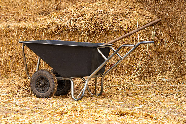 Old farm cart on hay background in rural countryside