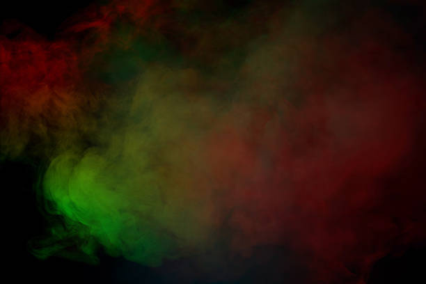 Orange and red steam on a black background. Copy space.