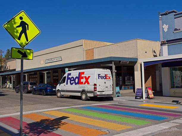 Petaluma, California - USA, October 20, 2025.  FedEx van making deliveries in downtown Petaluma California. Petaluma has a well preserved downtown and was known for its grain milling and chicken processing industries. Located along the Petaluma River in the North Bay district of San Francisco.