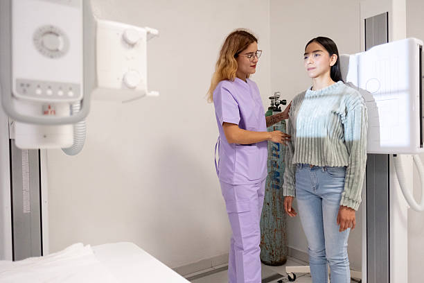 Nurse taking an X-ray of her patient