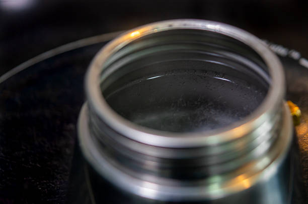 This is a photograph of a stack of reusable glass jars at home indoors.