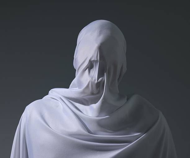 Creepy ghost. Man covered with white sheet on light grey background