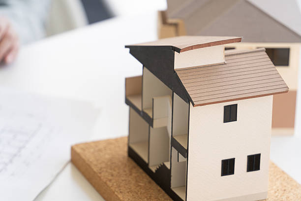 Architects, designers, workers, and engineers meeting at construction companies, house manufacturers, architectural firms, and builders to discuss houses