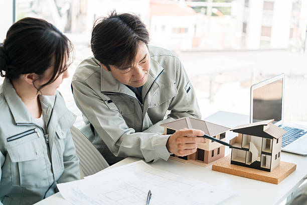 Architects, designers, workers, and engineers meeting at construction companies, house manufacturers, architectural firms, and builders to discuss houses