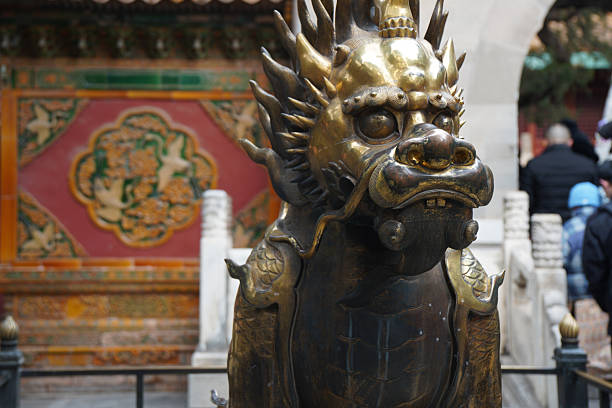 Golden dragon statue black background