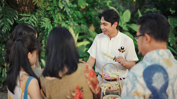 Traditional Indonesian Male Dancers Putting the Finishing Touches on Their Headbands