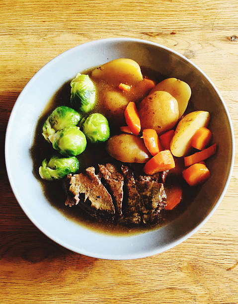 A festive roast dinner prepared for a Mother’s Day or Father’s Day celebration, showcasing a hearty home-cooked meal shared with loved ones. This image reflects gratitude, family connection, and meaningful moments around the table, perfect for seasonal holiday promotions and lifestyle storytelling.