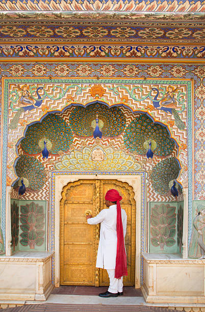 India Jaipur   The City palace of Jaipur guide by the Peacock door entrance