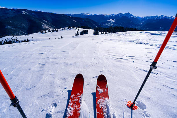 Skiing, winter season , mountains and ski equipments in mountains