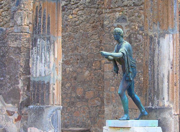 Herculaneum, Campania, Italy - June 29, 2021: Ruins of  ancient city destroyed by the eruption of the volcano Vesuvius in 79 AD near Naples, Archaeological Park of Ercolano. Statue of Marcus Nonius Balbus