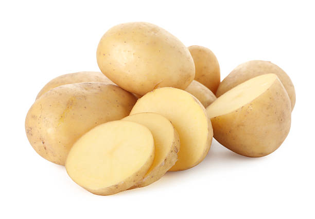 istock Whole and cut potatoes isolated on white 2258592084