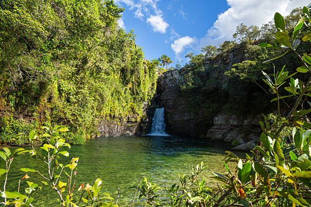 Young woman enjoying the waterfall Santa Barbara, Chapada dos Veadeiros