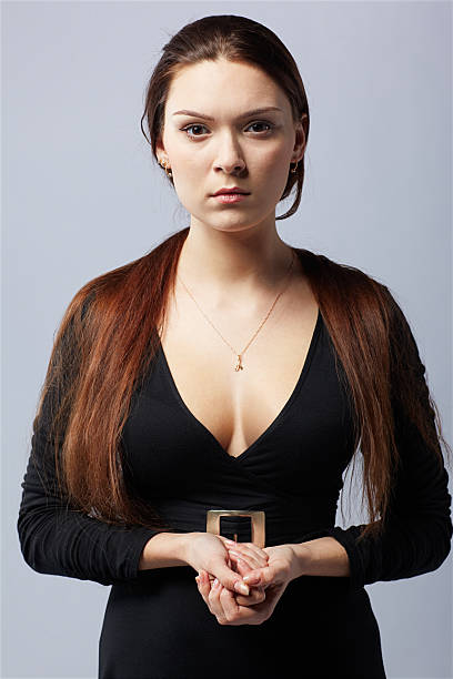 Fashionable pretty stylish woman in fashion trendy black clothes with one shoulder top