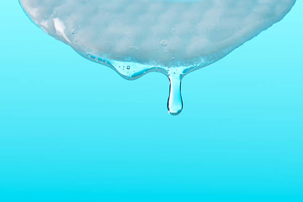 3d render. Close-up of a blue water droplet captured in mid-air as it splashes, surrounded by concentric ripples, emphasizing purity, freshness, and the beauty of natural elements.