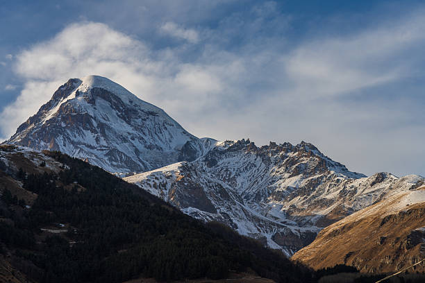 Snowy mountain ridge with sharp contours in alpine landscape. Suitable for wilderness, environment, and nature background use.