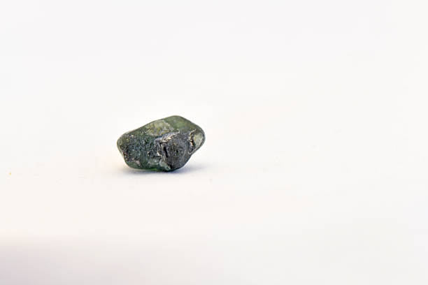 green aventurine macro detail texture background. close-up raw rough unpolished semi-precious gemstone