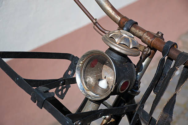 The metal wheel of an old bicycle.
