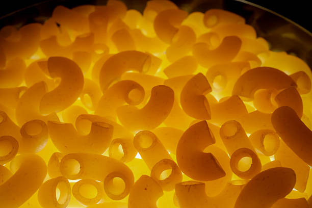 Macro Abstract Backlit Macaroni Pasta With Bright Yellow Glowing Texture