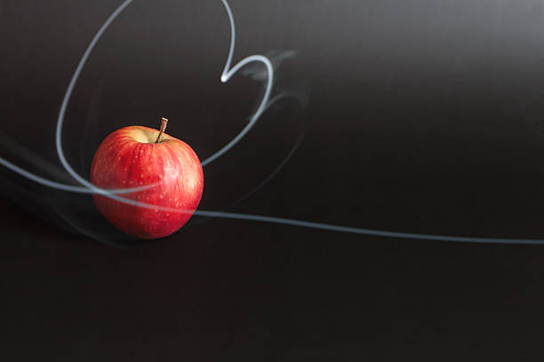 Apple with a heart-shaped bite taken out of it