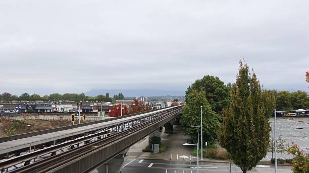 Lansdowne Station, Richmond, British Columbia, Canada- 2Oct 2025: Vancouver SkyTrain station the guideway for the Canada Line Elevated train track supported by concrete pillars running through urban