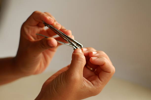 Close-Up of Fingernail Trimming with Nail Clipper