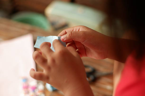 Child's Artistic Moment with Paper and Tools