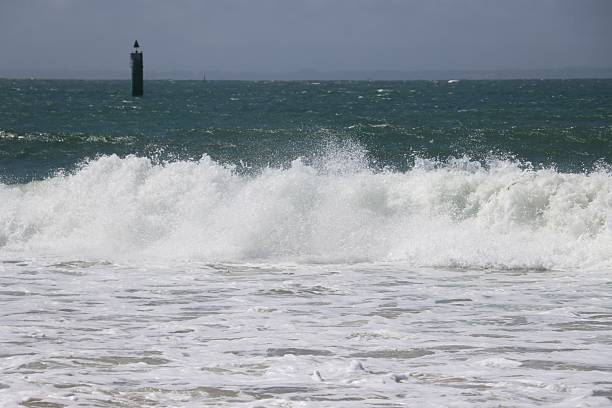 istock waves crashing on the beach 2258666665