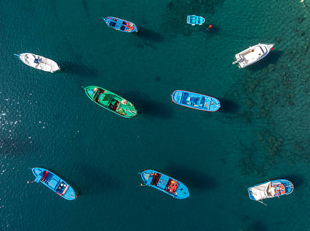 Overhead view of colorful boats anchored in shallow water, Tenerife, Canary Islands, Spain