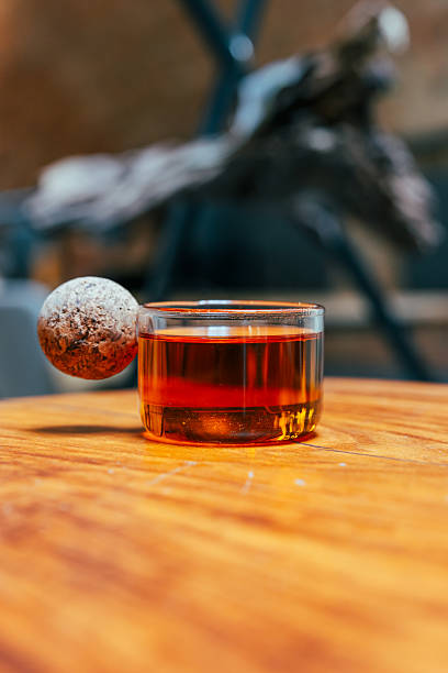 A glass of hot tea is serving at cafe.