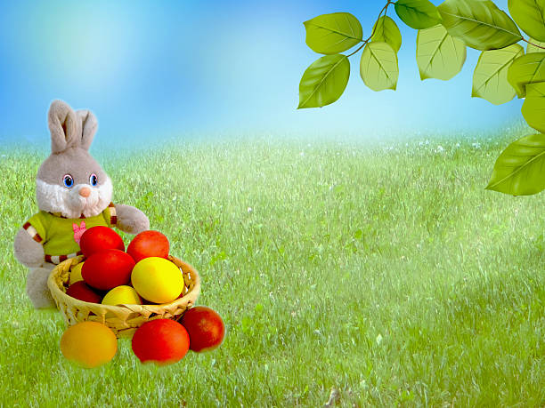 Fabulous fairy house decorated for Easter in shape of a muffin with colorful easter eggs on top against a green meadow. Easter and celebration concepts. Easy to crop for all print, social media and other design sizes.
