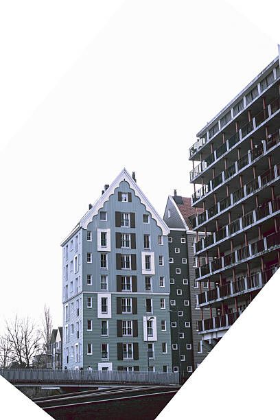 A contemporary architectural scene in the Netherlands featuring modern apartment buildings inspired by traditional Dutch gabled houses. Clean lines, pastel facades, geometric balconies, and reflections on calm water create a minimalist urban landscape with a strong sense of symmetry and design.