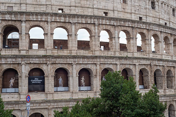 January 18, 2026, Rome, Italy: The Colosseum's iconic stone arches dominate the scene, revealing layered Roman architecture, historic textures, and the enduring presence of ancient civilization.
